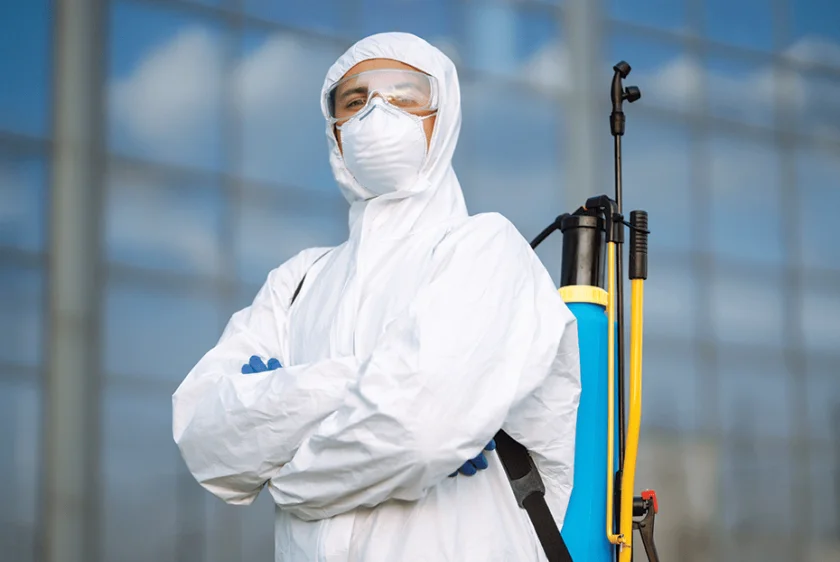 Technician performing pest control treatment